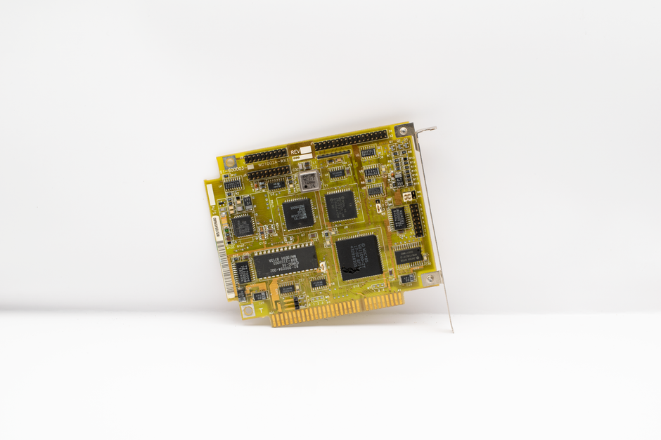 Antique circuit board showcasing vintage computing technology, isolated on a white background.