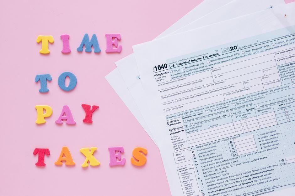 1040 tax forms with colorful 'Time to Pay Taxes' letters.
