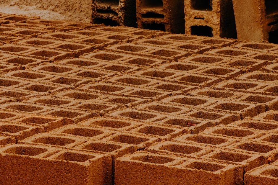 Close-up view of patterned concrete blocks in a construction site.