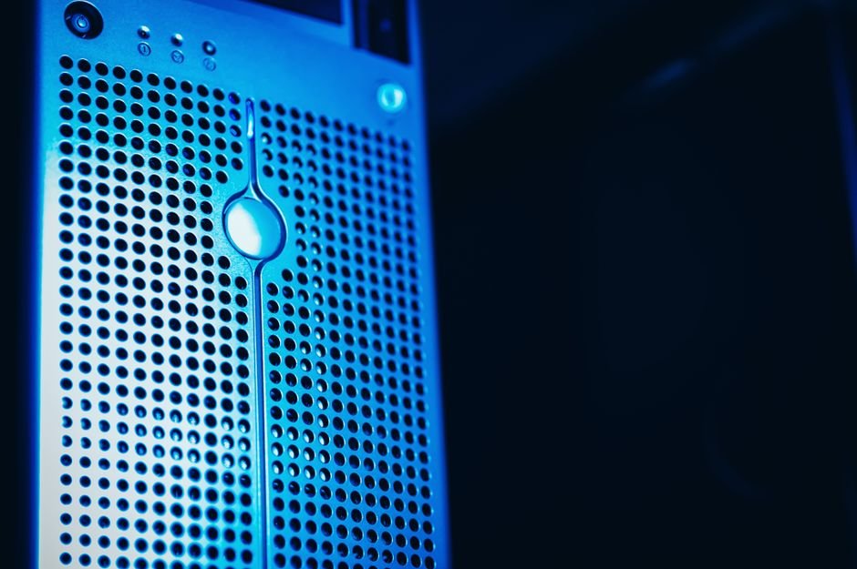 Modern server rack with blue lighting in a secure data center environment.